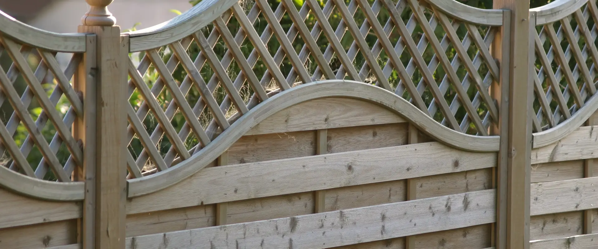 a wooden fence with a trellis