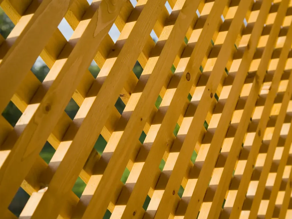 a close up of a wooden trellis