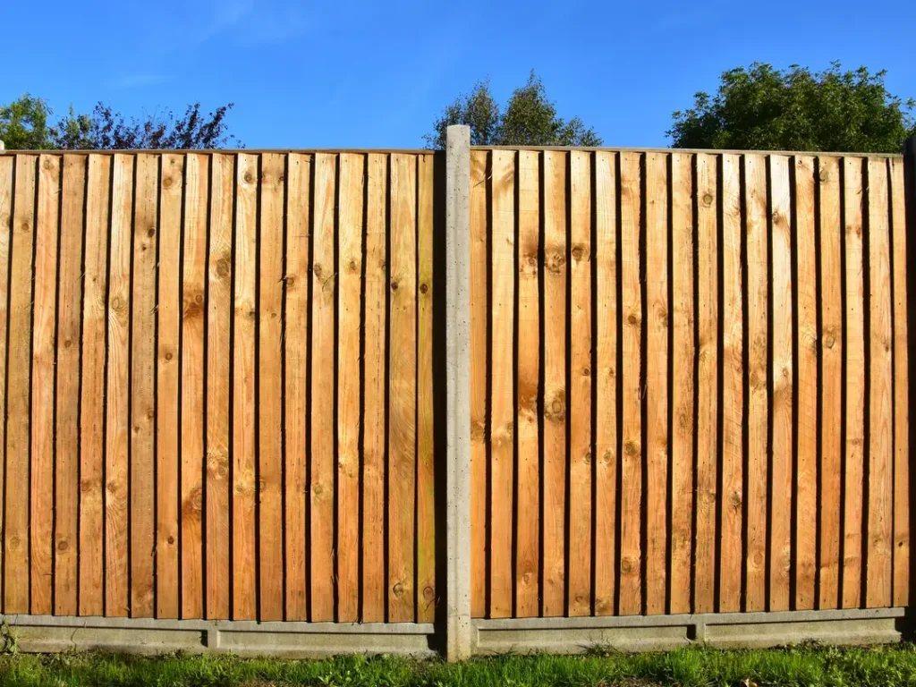 a wooden fence with a blue sky