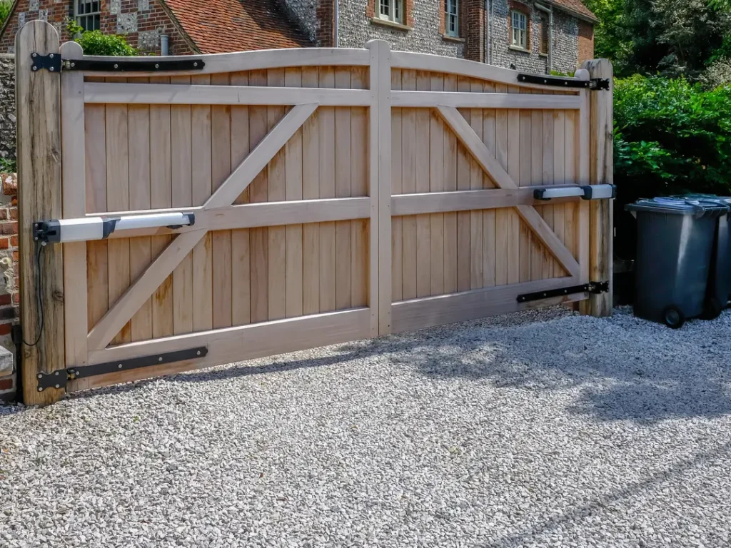 a wood fence with a metal bar