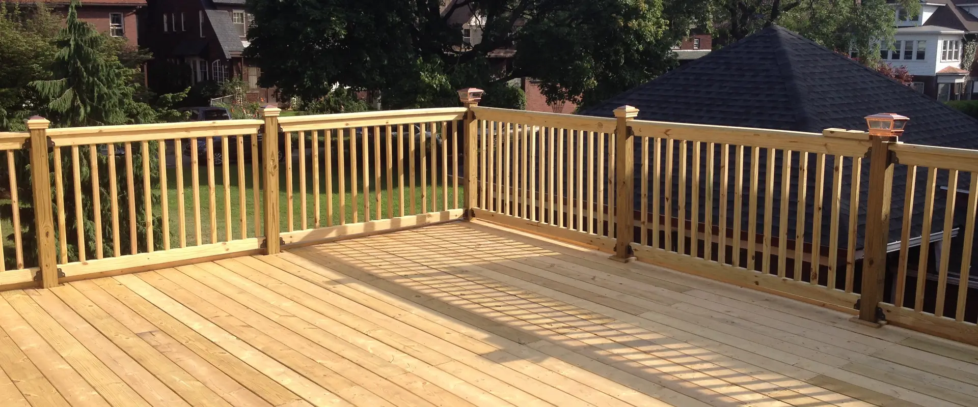 a wooden deck with a railing