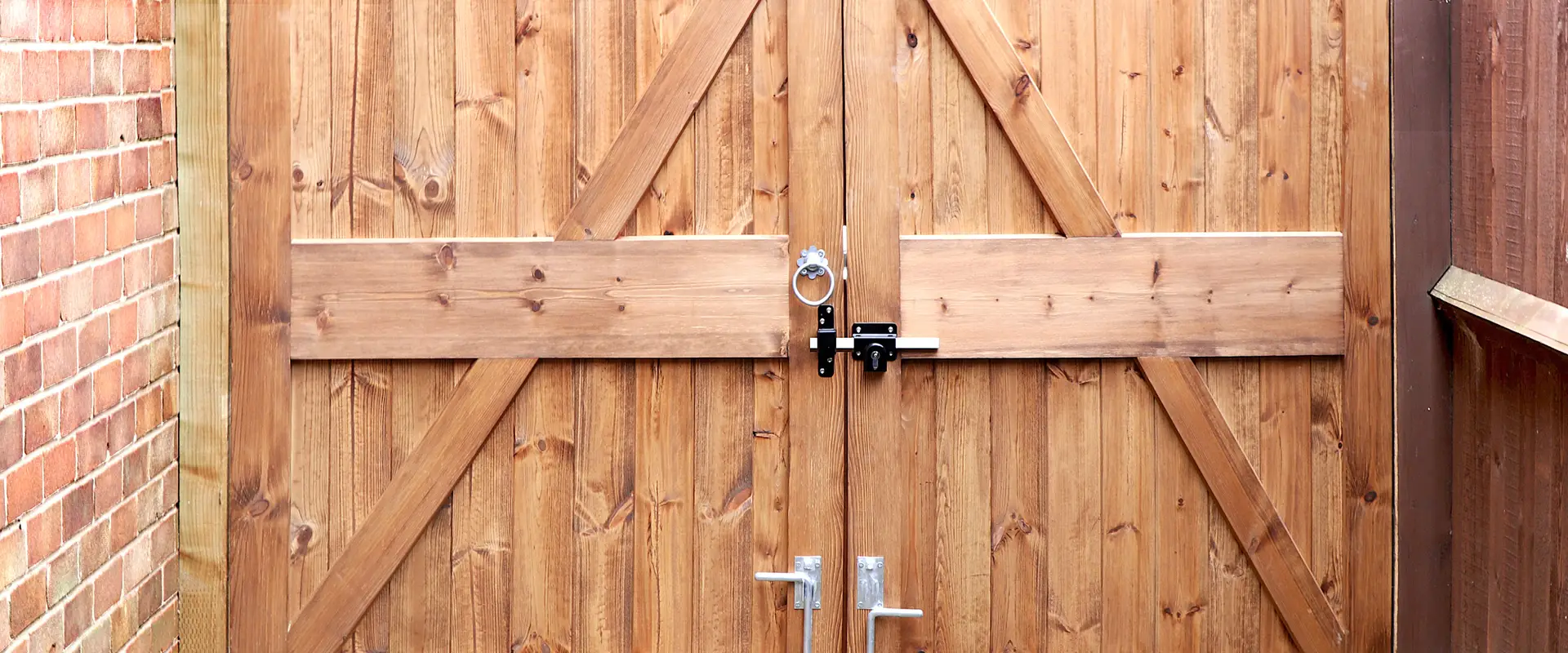 a wood gate with a lock